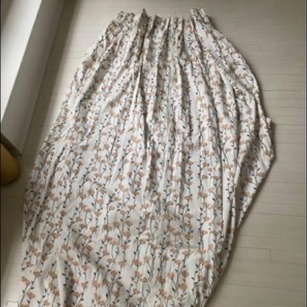 Custom fabric pinch pleat curtains with blackout lining.